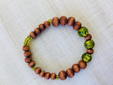 Natural Wood Beaded Bracelet in honey - green glass beads accents